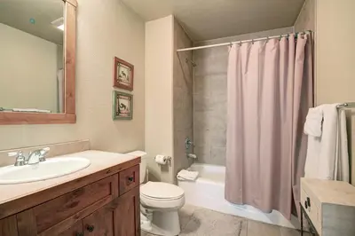 a bathroom with a sink and a toilet and a shower at 18 Autumn Brook Condo in Keystone