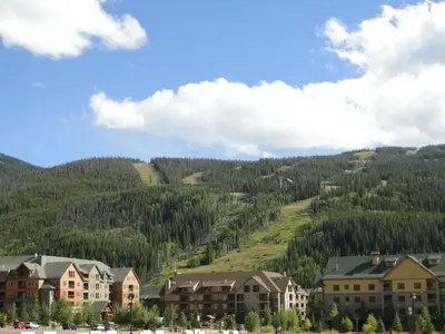 a group of houses in front of a mountain at 18 Autumn Brook Condo in Keystone