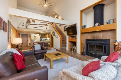 a living room with two couches and a fireplace at 2130 Pines Condo in Keystone