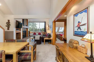 a living room with a couch and a table at 2130 Pines Condo in Keystone