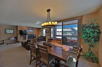 a dining room and living room with a table and chairs at A11 Snowblaze Athletic Club Condo in Winter Park