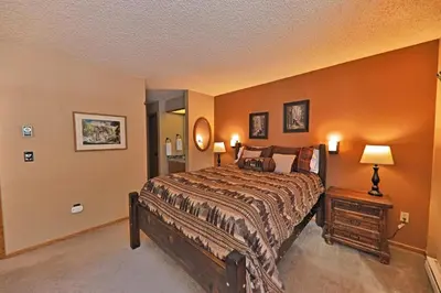 a bedroom with a large bed in a room at A11 Snowblaze Athletic Club Condo in Winter Park