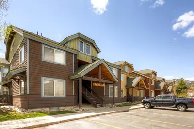 a row of houses with a car parked in front at Tarn Landing C-5 Condo in Frisco