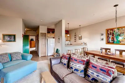 a living room with a couch and a table at Tarn Landing C-5 Condo in Frisco