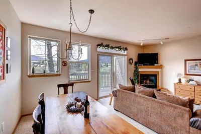 a living room with a couch and a table at Tarn Landing C-5 Condo in Frisco