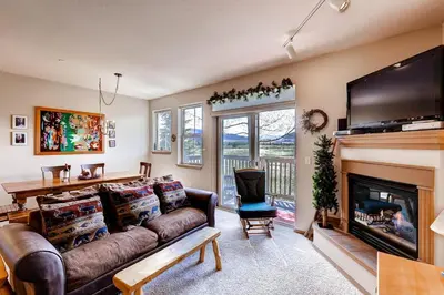a living room with a couch and a fireplace at Tarn Landing C-5 Condo in Frisco