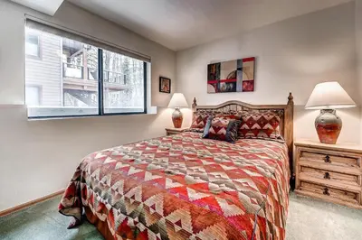 a bedroom with a bed and a window at Mountainside 673 Home in Frisco