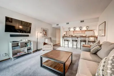 a living room with a couch and a table at Mountainside 229E Condo in Frisco