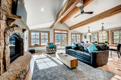a living room with a couch and a fireplace at Frisco Street Home in Frisco