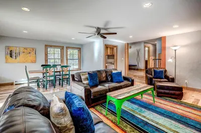 a living room with a couch and a table at Frisco Street Home in Frisco