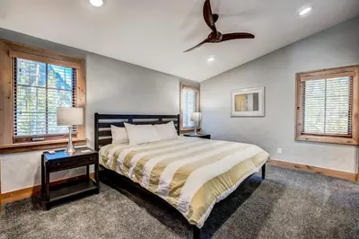 a bedroom with a bed and a ceiling fan at Frisco Street Home in Frisco