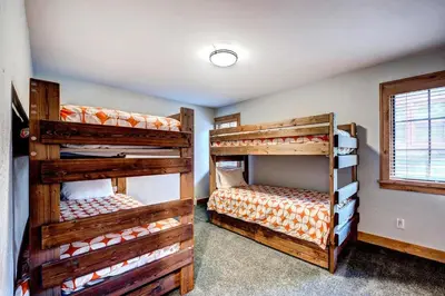 two sets of bunk beds in a room at Frisco Street Home in Frisco