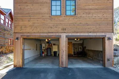 an empty garage with two entrances to a building at Frisco Street Home in Frisco