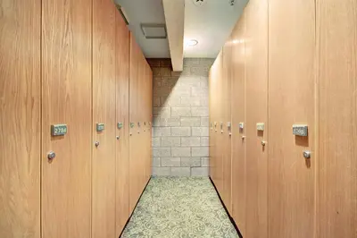 a row of wooden lockers in a locker room at Penthouse 2796 Slopeside Ski In Ski Out Condo in Keystone