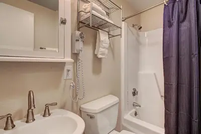 a bathroom with a sink and a toilet and a shower at 2964 Key Condo in Keystone