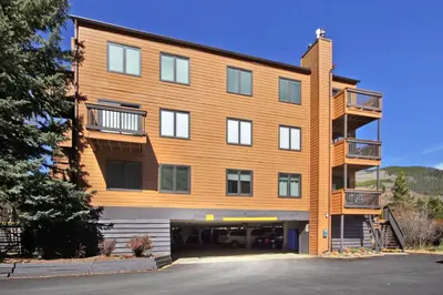 a large wooden building with a parking lot at 2964 Key Condo in Keystone
