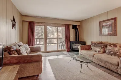 a living room with a couch and a fireplace at 2964 Key Condo in Keystone