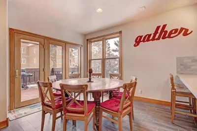 a dining room with a table and chairs at River Run Mill Creek Combo Condo in Keystone