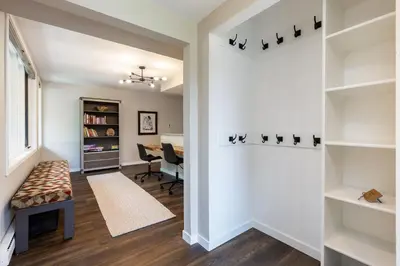 a hallway with a living room and a dining room at 2112 The Pines Condo in Keystone