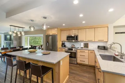 a kitchen with a large island with a counter top at 2112 The Pines Condo in Keystone