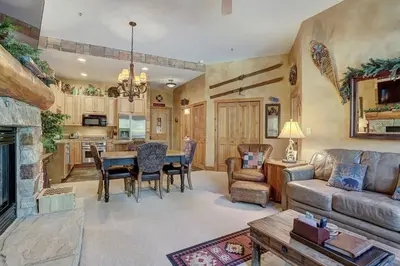 a living room with a couch and a table at 3056 The Timbers Condo in Keystone