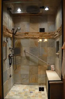 a shower with a glass door in a bathroom at Niwot Inn & Spa in Niwot