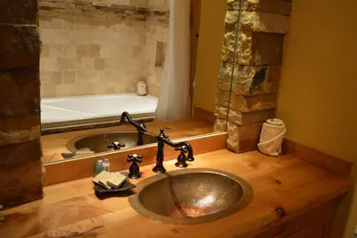 a bathroom with a sink and a bath tub at Niwot Inn & Spa in Niwot