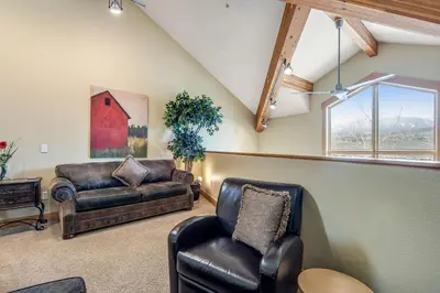 a living room with a couch and a chair at Dillon Ridge Retreat in Dillon
