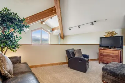 a living room with a couch and a tv at Dillon Ridge Retreat in Dillon
