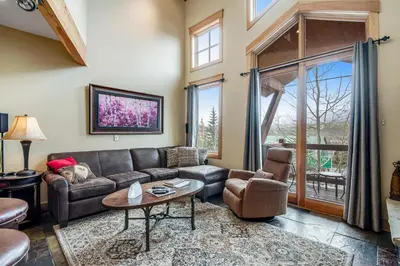 a living room with a couch and a table at Dillon Ridge Retreat in Dillon