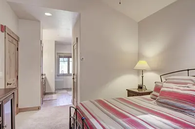 a bedroom with a bed and a lamp and a bathroom at 6509 Settlers Creek Townhomes in Keystone