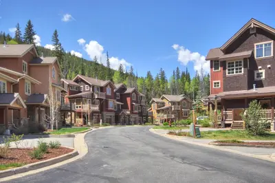 a street in a residential neighborhood with houses at 6509 Settlers Creek Townhomes in Keystone