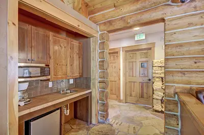 a kitchen with wooden cabinets and a counter top at 6509 Settlers Creek Townhomes in Keystone