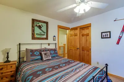 a bedroom with a bed and a ceiling fan at Meadow Creek in Frisco