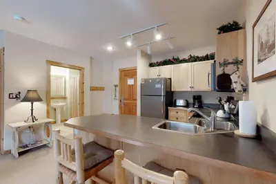 a kitchen with a sink and a counter top at The Dakota Outpost in Keystone