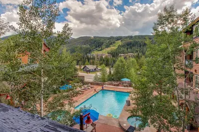 an overhead view of a swimming pool at a resort at The Dakota Outpost in Keystone