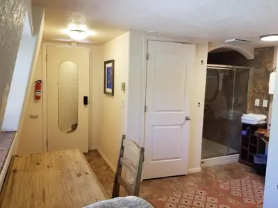 a room with a table and a white door at Kokopelli Inn in Estes Park