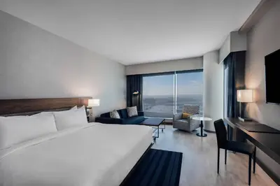 a hotel room with a bed and a large window at AC Hotel by Marriott Denver Downtown in Denver