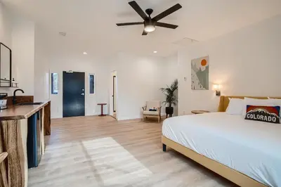 a bedroom with a bed and a ceiling fan at Uplift Inn in Idaho Springs