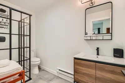a bathroom with a sink and a mirror at Uplift Inn in Idaho Springs