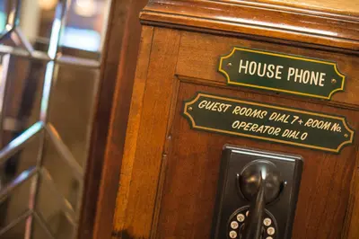 a door with a house phone sign on it at Hotel Boulderado in Boulder