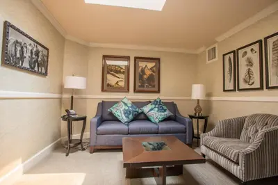 a living room with a couch and a table at Hotel Boulderado in Boulder
