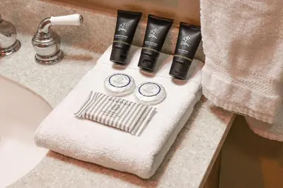 a bathroom counter with a white towel on a sink at Ten Mile Creek Condo: Downtown Frisco, Hot Tub in Frisco