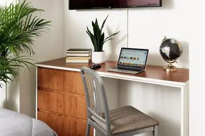 a desk with a laptop computer on top of it at InTown Suites Extended Stay Denver - Havana Street in Aurora
