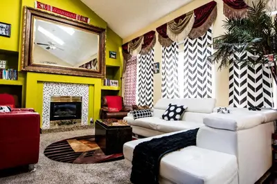 a living room with a couch and a fireplace at Airport Lay Over in Denver