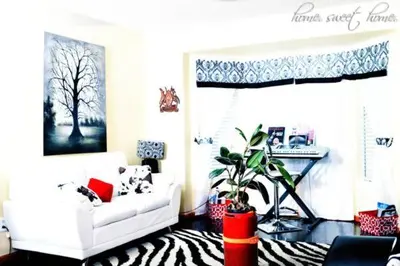 a living room with a white couch and a zebra rug at Airport Lay Over in Denver