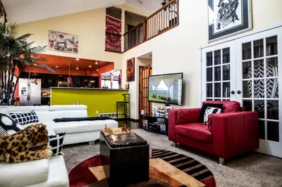 a living room with couches and a tv at Airport Lay Over in Denver