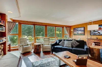 a living room with a couch and a table at Decatur 1779 in Keystone