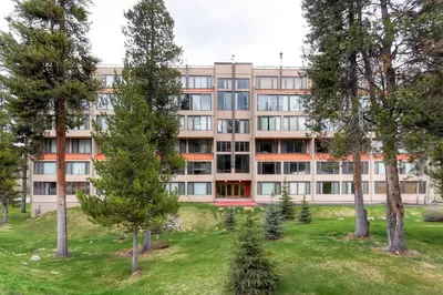 an apartment building with trees in front of it at Decatur 1779 in Keystone