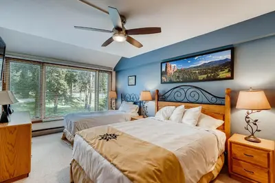 a bedroom with two beds and a ceiling fan at Decatur 1779 in Keystone